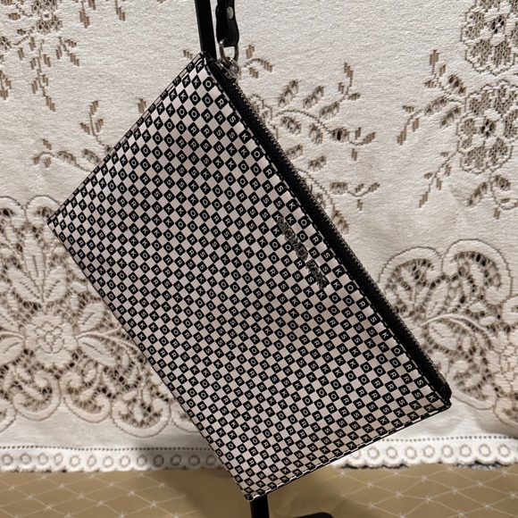 Michael Kors Handbags - Michael Kors Black and White Geometric Clutch